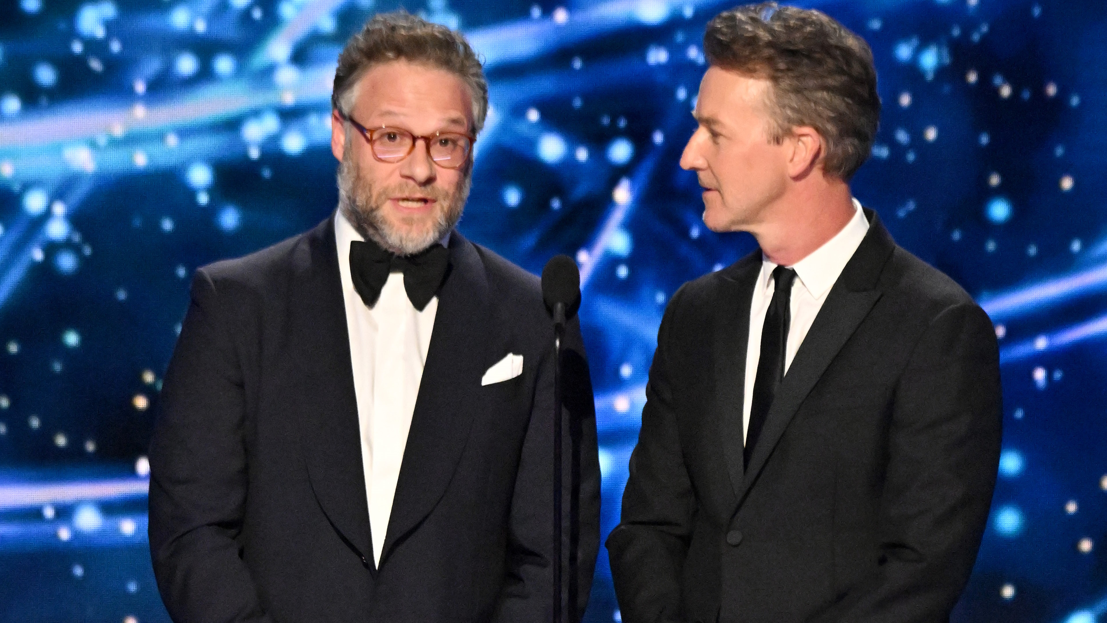 SANTA MONICA, CALIFORNIA - APRIL 05: (L-R) Seth Rogen and Edward Norton speak onstage during the 11th Breakthrough Prize Ceremony at Barker Hangar on April 05, 2025 in Santa Monica, California. (Photo by Lester Cohen/Getty Images for Breakthrough Prize)