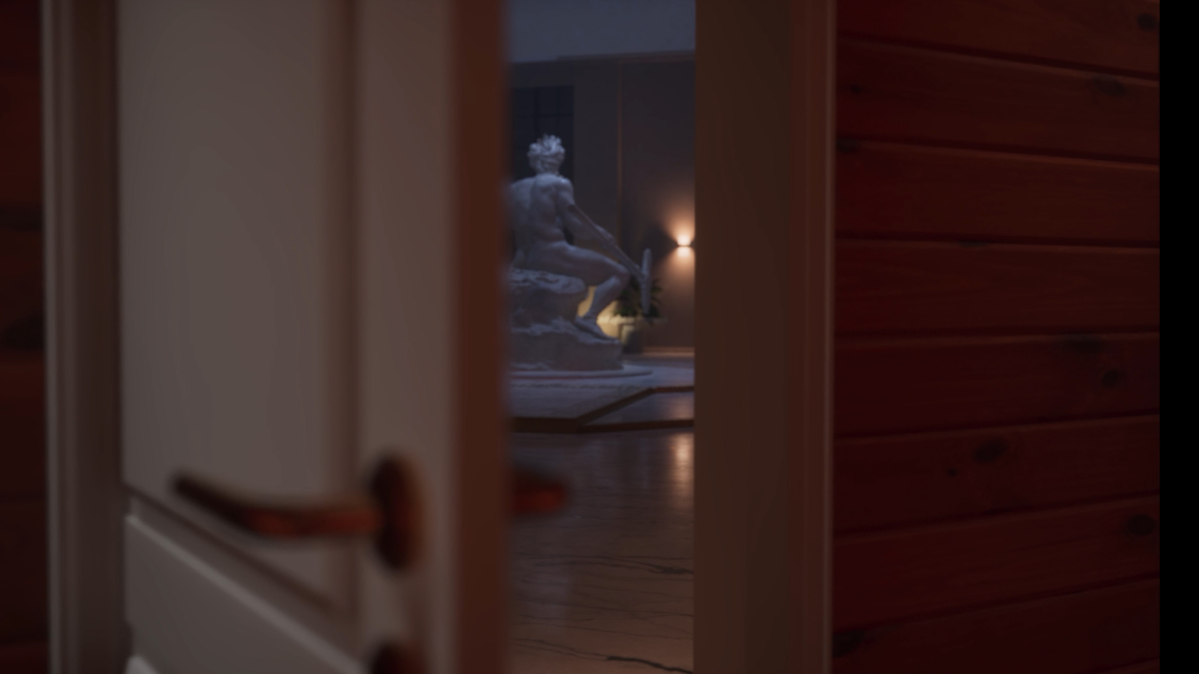 Peeking through a door at a freaky statue in Dead Take