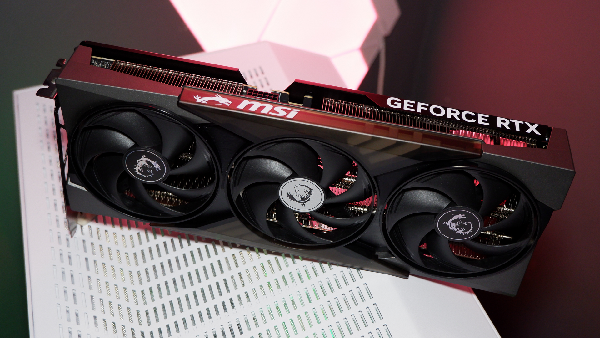 An MSI RTX 5060 Ti on top of a PC case and with the rear backplate removed.