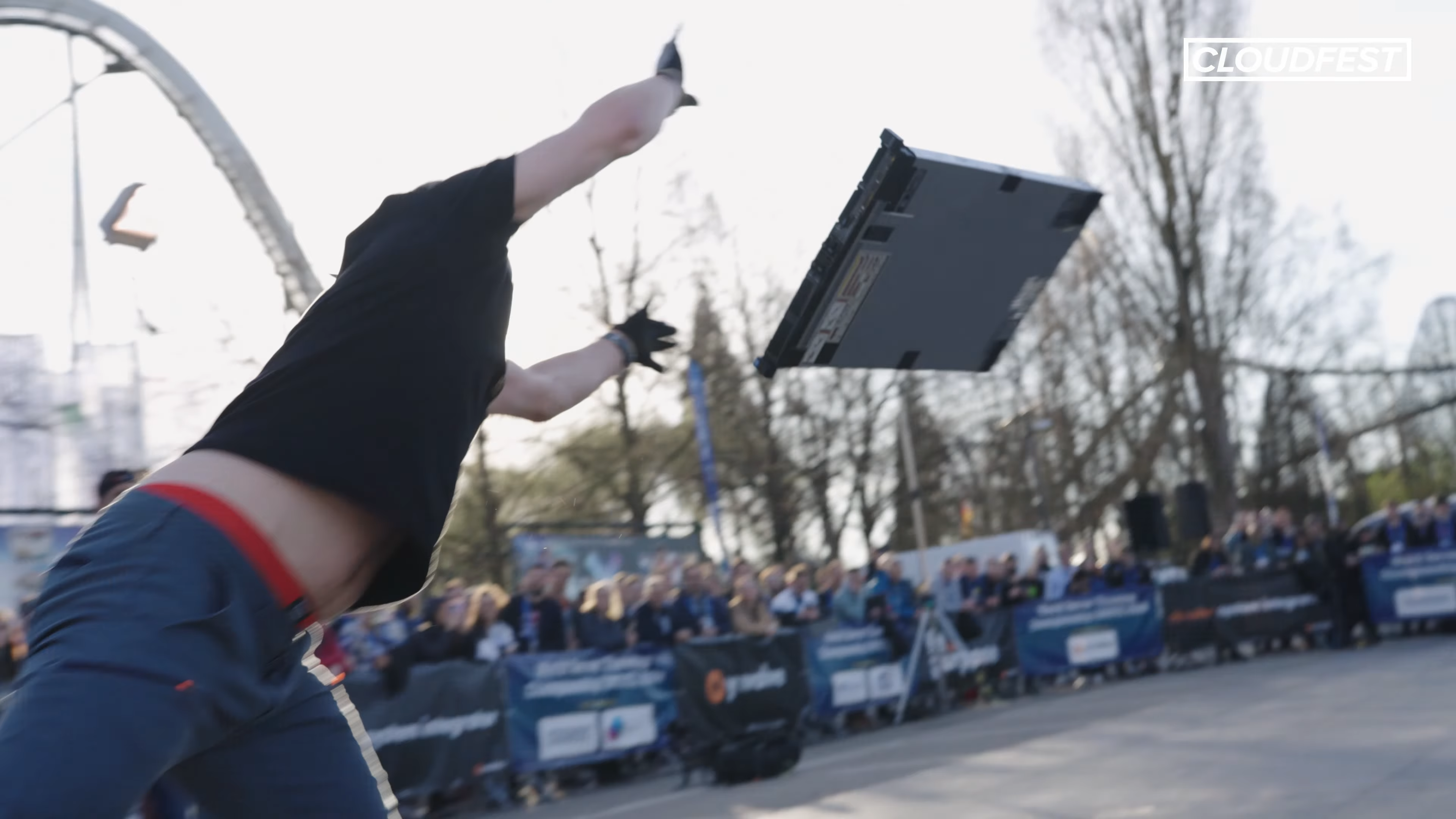 An unknown competitor flings a server at the World Server Throwing Championship held at CloudFest 2024.