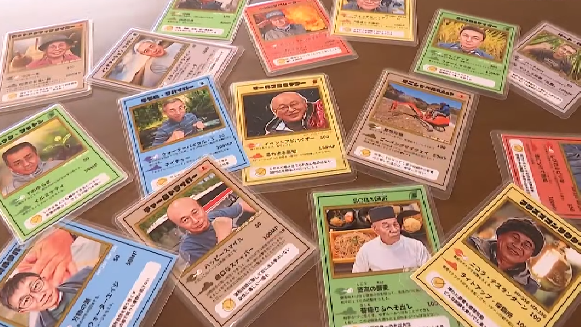 A screenshot of the Ojisan Card Game taken from the original Fuji News Network broadcast, showing a selection of the middle-aged man cards on a table 